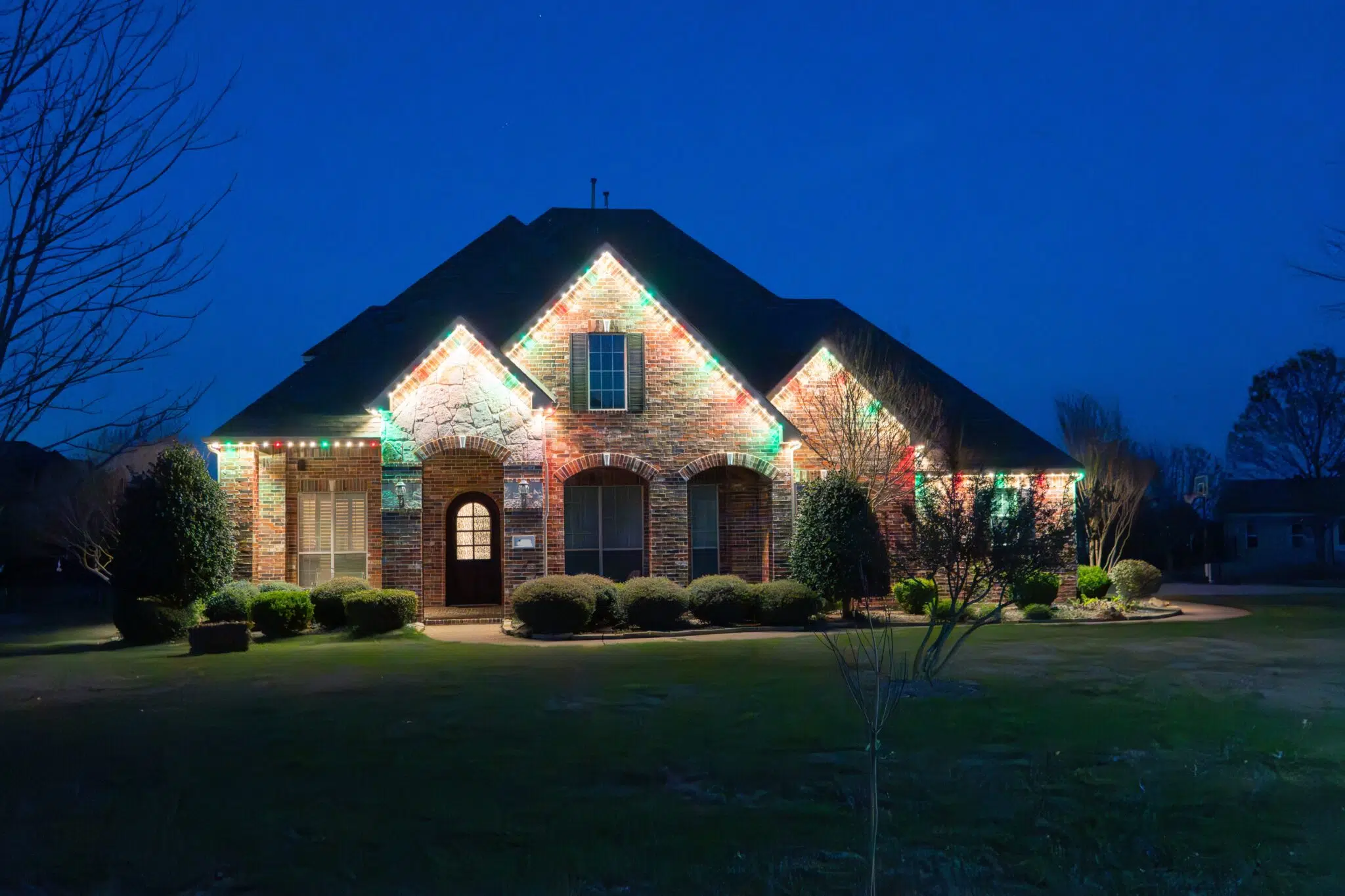 Elegant Christmas light display on a residential property in OKC
